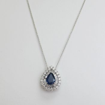 18KT White Gold Tapered Baguettes And Round Brilliant Diamond And Pear Shape Blue Sapphire Pendant With 17" Chain That Adjusts To 16"     